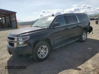 2015 Chevrolet Suburban LT with VIN 1GNSKJKC4FR694347, listed as a Copart auction lot 59358475 with 209,495 mi miles and Salvage title. Bid and sale history available at DreamBid. Image 1.