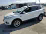 2018 Ford Escape SE with VIN 1FMCU9GDXJUB59001, listed as a Copart auction lot 84057235 with 60,517 mi miles and Salvage title. Bid and sale history available at DreamBid. Image 1.