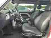 2006 MINI Hardtop with VIN WMWRC33526TK66647, listed as a Copart auction lot 81100025 with 179,203 mi miles and Salvage title. Bid and sale history available at DreamBid. Image 7.