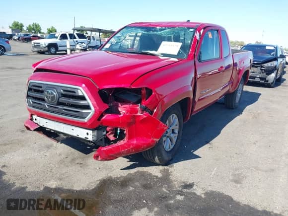 2018 Toyota Tacoma SR with VIN 5TFRX5GN4JX120443, listed as a IAAI auction lot 42755579 with 63,186 mi miles and . Bid and sale history available at DreamBid. Image 2.