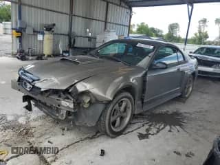 2002 Ford Mustang GT Deluxe с VIN 1FAFP42XX2F117811, выставлен на аукционе Copart как лот 60275415 с пробегом Не указан миль и Списание • Salvage title. История ставок и продаж доступна на DreamBid. Изображение 1.