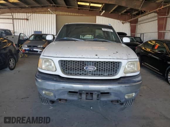 1999 Ford F-150 z VIN 1FTRX18W9XKA31862, wystawiony jako Copart lot #80758555 z przebiegiem 150 645 mil mil oraz Szkoda całkowita • Salvage title. Historia ofert i sprzedaży dostępna na DreamBid. Obrazek 5.