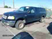 2000 Ford F-150 XL with VIN 1FTRX18W1YNC02247, listed as a IAAI auction lot 43464551 with Not provided miles and . Bid and sale history available at DreamBid. Image 2.