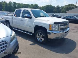 2013 Chevrolet Silverado 1500 LT z VIN 3GCPCSE0XDG129584, wystawiony jako IAAI lot #43154442 z przebiegiem 148 319 mil mil oraz . Historia ofert i sprzedaży dostępna na DreamBid. Obrazek 1.
