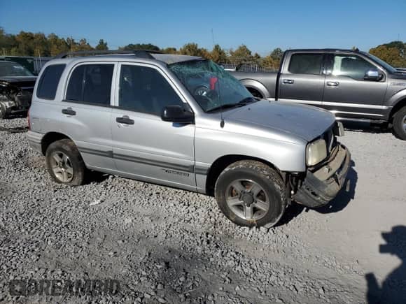 2003 Chevrolet Tracker z VIN 2CNBE13C636908563, wystawiony jako Copart lot #76871754 z przebiegiem 205 684 mil mil oraz Szkoda całkowita • Salvage title. Historia ofert i sprzedaży dostępna na DreamBid. Obrazek 4.