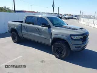 2023 Ram 1500 TRX z VIN 1C6SRFU90PN660151, wystawiony jako IAAI lot #42718650 z przebiegiem 32 707 mil mil oraz . Historia ofert i sprzedaży dostępna na DreamBid. Obrazek 1.