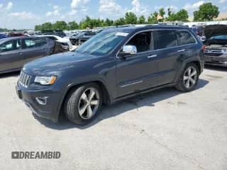 2016 Jeep Grand Cherokee Overland with VIN 1C4RJFCG9GC389584, listed as a Copart auction lot 61002345 with 153,550 mi miles and Salvage title. Bid and sale history available at DreamBid. Image 1.