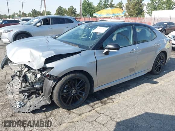 2023 Toyota Camry Hybrid XSE with VIN 4T1K31AK0PU051132, listed as a IAAI auction lot 42945793 with 48,781 mi miles and . Bid and sale history available at DreamBid. Image 2.