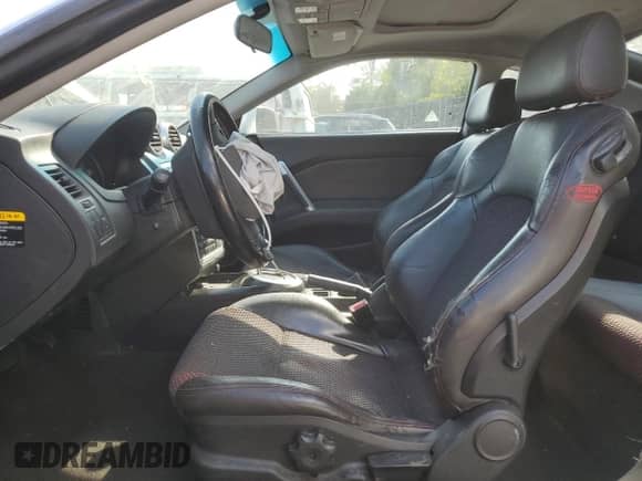 2006 Hyundai Tiburon GT с VIN KMHHN65F76U229244, выставлен на аукционе Copart как лот 71157904 с пробегом 228 575 миль миль и Списание • Salvage title. История ставок и продаж доступна на DreamBid. Изображение 7.