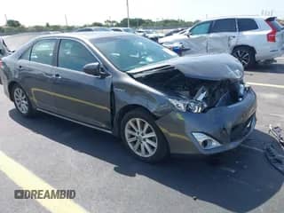 2014 Toyota Camry LE with VIN 4T1BD1FK8EU100144, listed as a IAAI auction lot 43063340 with 276,189 mi miles and . Bid and sale history available at DreamBid. Image 1.