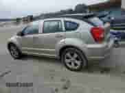 2010 Dodge Caliber SXT with VIN 1B3CB4HAXAD540088, listed as a Copart auction lot 68734845 with 153,998 mi miles and Salvage title. Bid and sale history available at DreamBid. Image 2.