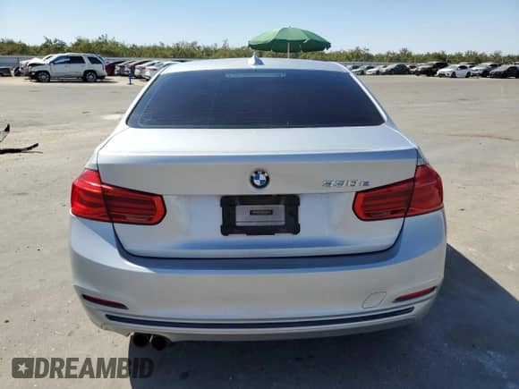 2018 BMW 3 Series 330e with VIN WBA8E1C52JA167468, listed as a Copart auction lot 69873605 with 98,631 mi miles and Salvage title. Bid and sale history available at DreamBid. Image 6.
