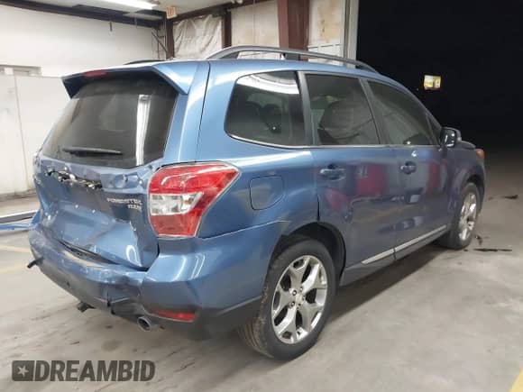 2015 Subaru Forester Touring with VIN JF2SJAUC9FH807385, listed as a IAAI auction lot 43508096 with 103,862 mi miles and . Bid and sale history available at DreamBid. Image 4.
