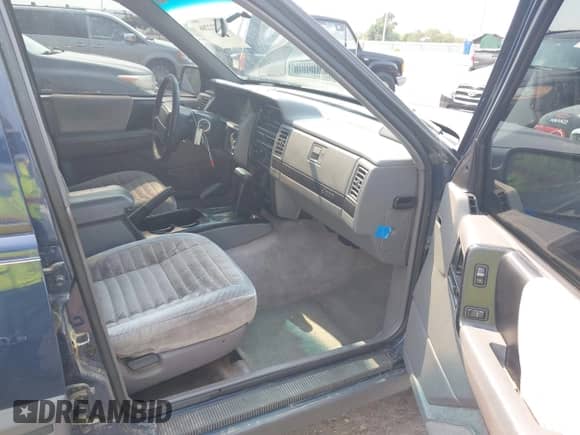 1994 Jeep Grand Cherokee Laredo with VIN 1J4GZ58Y7RC233746, listed as a IAAI auction lot 42722206 with 196,875 mi miles and . Bid and sale history available at DreamBid. Image 5.