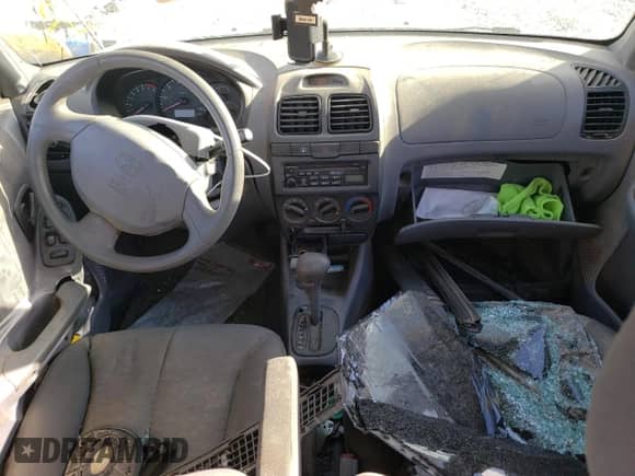 2003 Hyundai Accent GL с VIN KMHCG45CX3U482360, выставлен на аукционе Copart как лот 68657183 с пробегом Не указан миль и Списание • Salvage title. История ставок и продаж доступна на DreamBid. Изображение 8.