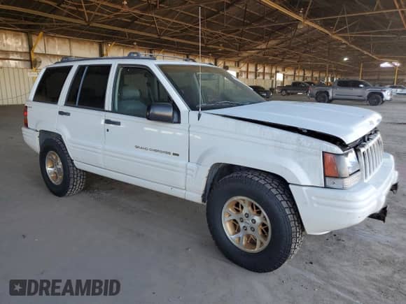 1996 Jeep Grand Cherokee with VIN 1J4EZ78Y9TC104398, listed as a Copart auction lot 69706254 with Not provided miles and Salvage title. Bid and sale history available at DreamBid. Image 4.