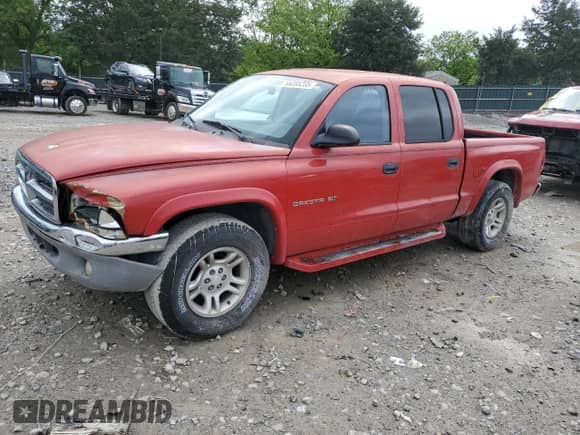 2002 Dodge Dakota SLT z VIN 1B7HL48N62S505775, wystawiony jako Copart lot #56285235 z przebiegiem 132 841 mil mil oraz Czysty tytuł • Clean title. Historia ofert i sprzedaży dostępna na DreamBid. Obrazek 1.
