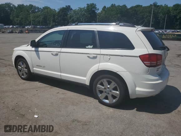 2010 Dodge Journey SXT with VIN 3D4PH5FV3AT283525, listed as a Copart auction lot 66740145 with 142,143 mi miles and Salvage title. Bid and sale history available at DreamBid. Image 2.