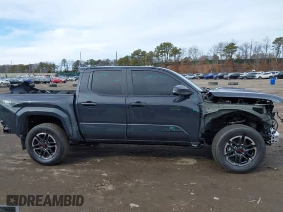 2024 Toyota Tacoma SR5 with VIN 3TYLB5JN1RT039046, listed as a IAAI auction lot 41610499 with 6,455 mi miles and . Bid and sale history available at DreamBid. Image 14.