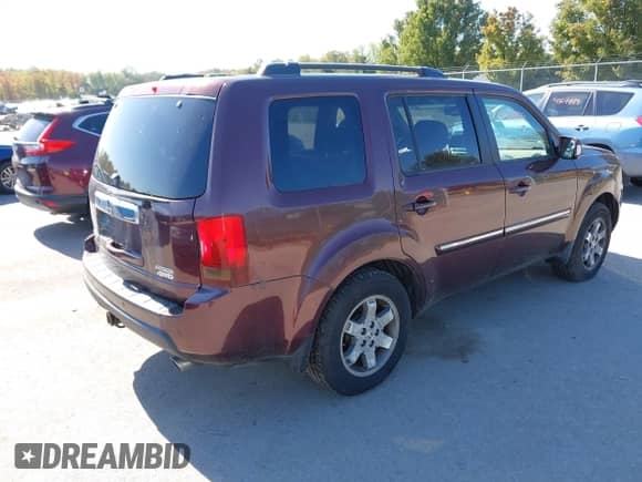 2010 Honda Pilot Touring with VIN 5FNYF4H99AB040690, listed as a IAAI auction lot 43338979 with 228,177 mi miles and . Bid and sale history available at DreamBid. Image 4.