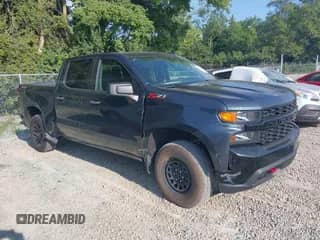 2021 Chevrolet Silverado 1500 Custom Trail Boss z VIN 3GCPYCEF1MG132403, wystawiony jako IAAI lot #42932575 z przebiegiem 49 992 mil mil oraz . Historia ofert i sprzedaży dostępna na DreamBid. Obrazek 1.