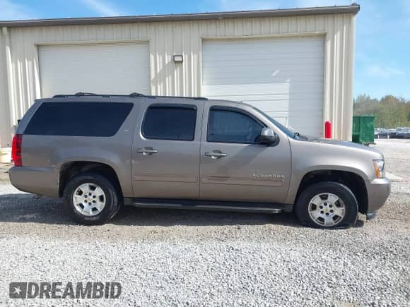 2011 Chevrolet Suburban LT z VIN 1GNSCJE09BR344091, wystawiony jako IAAI lot #43487649 z przebiegiem 182 652 mil mil oraz . Historia ofert i sprzedaży dostępna na DreamBid. Obrazek 13.