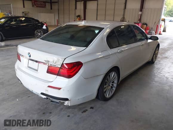 2014 BMW 7 Series ALPINA B7 with VIN WBAYE8C53ED780597, listed as a IAAI auction lot 43130128 with 98,724 mi miles and . Bid and sale history available at DreamBid. Image 4.