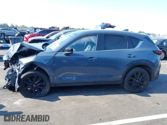 2023 Mazda CX-5 S Preferred z VIN JM3KFBCM6P0209360, wystawiony jako IAAI lot #43123619 z przebiegiem Nie podano mil oraz . Historia ofert i sprzedaży dostępna na DreamBid. Obrazek 13.