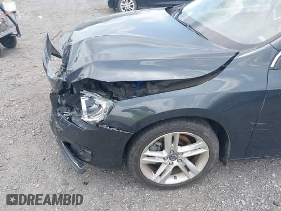 2015 Volvo S60 T5 Drive-E Premier with VIN YV140MFK4F2337702, listed as a IAAI auction lot 42771004 with 129,348 mi miles and . Bid and sale history available at DreamBid. Image 12.