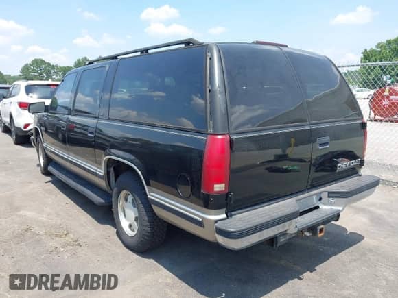 1999 Chevrolet Suburban z VIN 3GNEC16R6XG215324, wystawiony jako IAAI lot #42578528 z przebiegiem 242 538 mil mil oraz . Historia ofert i sprzedaży dostępna na DreamBid. Obrazek 3.