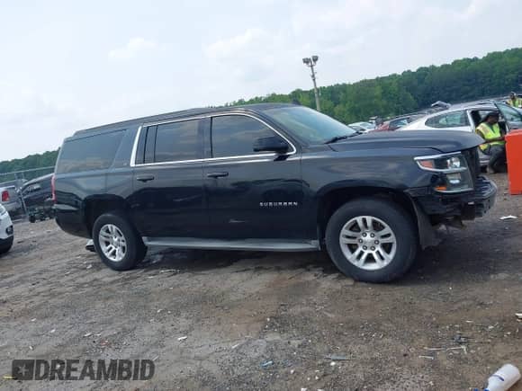 2015 Chevrolet Suburban LT with VIN 1GNSCJKC1FR591934, listed as a IAAI auction lot 42403284 with 299,882 mi miles and . Bid and sale history available at DreamBid. Image 14.