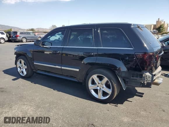2007 Jeep Grand Cherokee SRT-8 с VIN 1J8HR78377C631328, выставлен на аукционе Copart как лот 70689995 с пробегом 182 767 миль миль и Списание • Salvage title. История ставок и продаж доступна на DreamBid. Изображение 2.