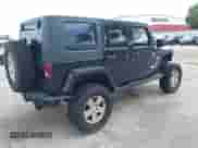 2007 Jeep Wrangler Unlimited Sahara z VIN 1J8GA59187L104774, wystawiony jako IAAI lot #42485359 z przebiegiem 192 254 mil mil oraz . Historia ofert i sprzedaży dostępna na DreamBid. Obrazek 4.