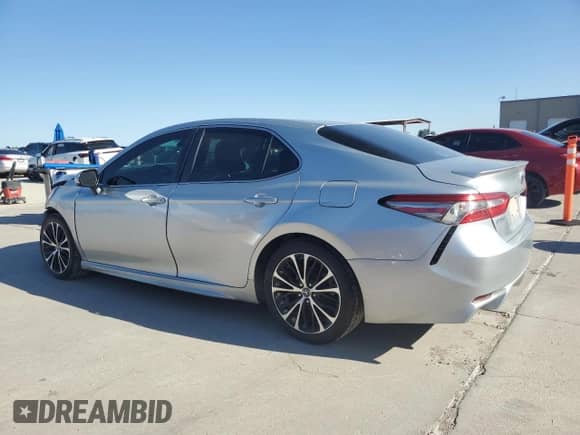 2018 Toyota Camry SE с VIN 4T1B11HK2JU002582, выставлен на аукционе Copart как лот 82613755 с пробегом 133 835 миль миль и Списание • Salvage title. История ставок и продаж доступна на DreamBid. Изображение 2.