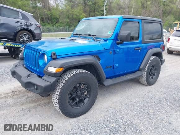 2022 Jeep Wrangler Sport S with VIN 1C4GJXAG0NW145642, listed as a IAAI auction lot 42112670 with 8,737 mi miles and . Bid and sale history available at DreamBid. Image 2.