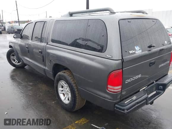 2004 Dodge Dakota Sport z VIN 1D7HL38N94S651302, wystawiony jako IAAI lot #41504334 z przebiegiem Nie podano mil oraz . Historia ofert i sprzedaży dostępna na DreamBid. Obrazek 3.