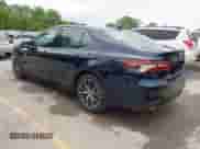 2021 Toyota Camry Hybrid XLE with VIN 4T1F31AK8MU563752, listed as a IAAI auction lot 42134620 with 19,484 mi miles and . Bid and sale history available at DreamBid. Image 3.