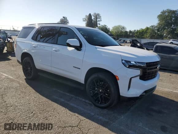 2023 Chevrolet Tahoe RST with VIN 1GNSKRKDXPR120716, listed as a Copart auction lot 52699355 with 44,323 mi miles and Salvage title. Bid and sale history available at DreamBid. Image 4.