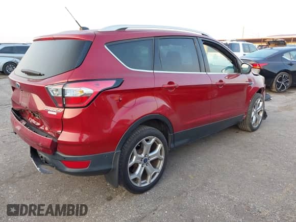 2017 Ford Escape Titanium with VIN 1FMCU0J97HUB23535, listed as a IAAI auction lot 43246540 with 97,026 mi miles and . Bid and sale history available at DreamBid. Image 4.