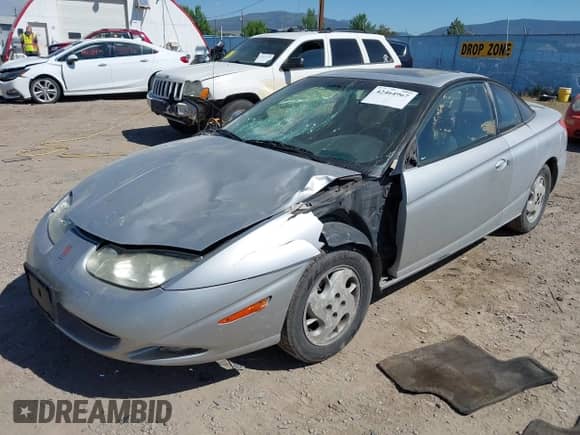 2002 Saturn SC with VIN 1G8ZY12722Z243236, listed as a IAAI auction lot 42464967 with 148,855 mi miles and . Bid and sale history available at DreamBid. Image 18.