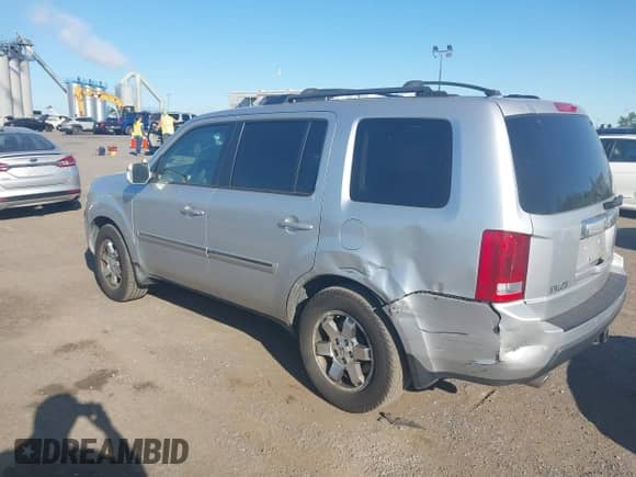 2009 Honda Pilot Touring with VIN 5FNYF488X9B023366, listed as a IAAI auction lot 43068300 with 210,590 mi miles and . Bid and sale history available at DreamBid. Image 3.