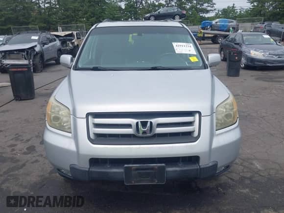 2006 Honda Pilot EX-L z VIN 2HKYF18566H538804, wystawiony jako IAAI lot #42911234 z przebiegiem 153 990 mil mil oraz . Historia ofert i sprzedaży dostępna na DreamBid. Obrazek 13.