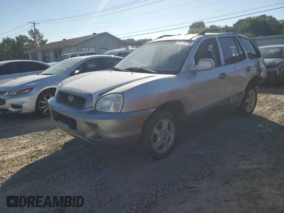 2002 Hyundai Santa Fe GLS z VIN KM8SC13D72U229318, wystawiony jako Copart lot #73178274 z przebiegiem Nie podano mil oraz Czysty tytuł • Clean title. Historia ofert i sprzedaży dostępna na DreamBid. Obrazek 1.