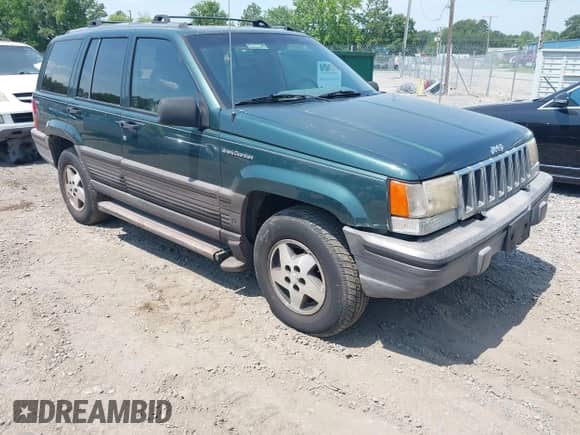 1994 Jeep Grand Cherokee Laredo with VIN 1J4GZ58Y5RC145018, listed as a IAAI auction lot 42590945 with 266,020 mi miles and . Bid and sale history available at DreamBid. Image 1.