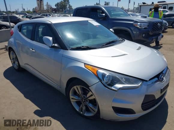 2012 Hyundai Veloster w/Gray Int z VIN KMHTC6AD6CU079711, wystawiony jako IAAI lot #41750279 z przebiegiem 154 746 mil mil oraz . Historia ofert i sprzedaży dostępna na DreamBid. Obrazek 1.