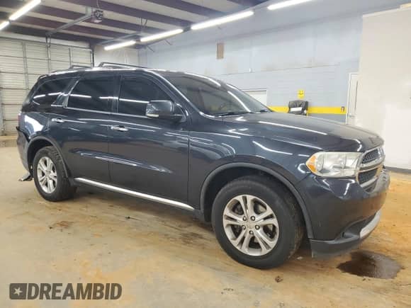2013 Dodge Durango Crew with VIN 1C4RDJDG9DC682700, listed as a Copart auction lot 68078015 with 169,828 mi miles and Salvage title. Bid and sale history available at DreamBid. Image 4.