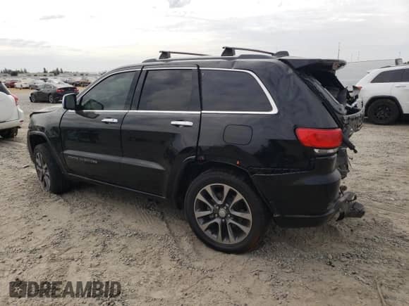 2017 Jeep Grand Cherokee Overland with VIN 1C4RJFCG2HC866857, listed as a Copart auction lot 81090725 with 119,242 mi miles and Salvage title. Bid and sale history available at DreamBid. Image 2.