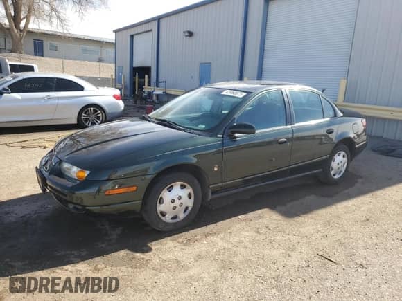 2000 Saturn SL with VIN 1G8ZG5286YZ181917, listed as a Copart auction lot 43960675 with 220,481 mi miles and Salvage title. Bid and sale history available at DreamBid. Image 1.