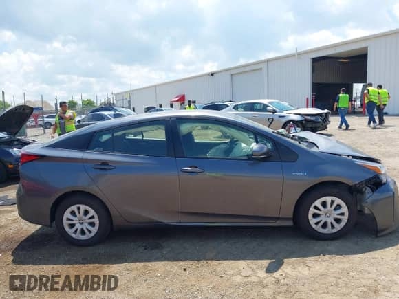 2022 Toyota Prius L Eco with VIN JTDKAMFU5N3160758, listed as a IAAI auction lot 42699871 with 64,403 mi miles and . Bid and sale history available at DreamBid. Image 13.