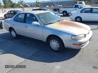 1992 Toyota Camry LE z VIN 4T1SK12E2NU112215, wystawiony jako IAAI lot #42605927 z przebiegiem 274 818 mil mil oraz . Historia ofert i sprzedaży dostępna na DreamBid. Obrazek 1.